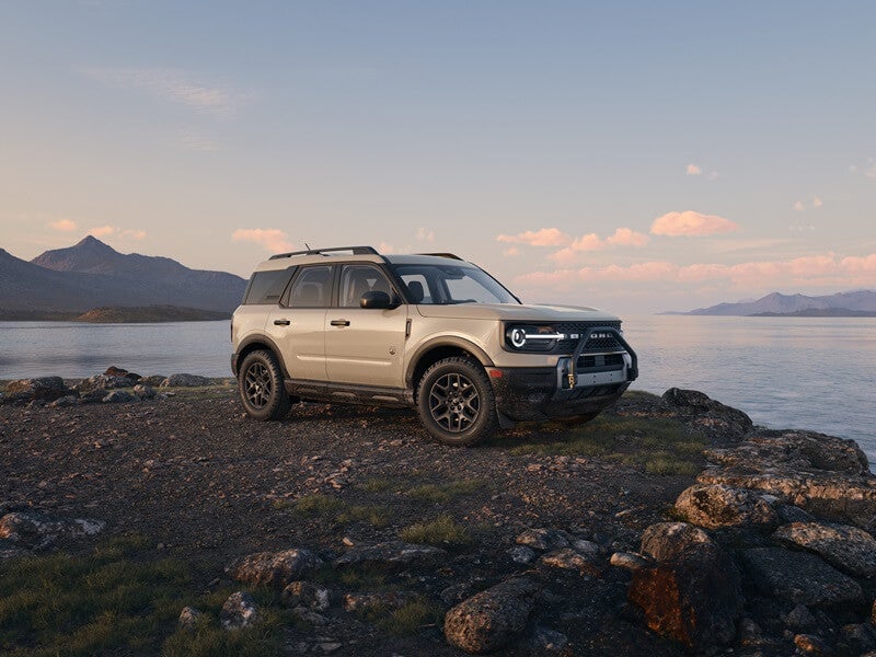 Ford Bronco Sport parked on top of cliff overlooking sunset from Used Car Dealer near Vista CA