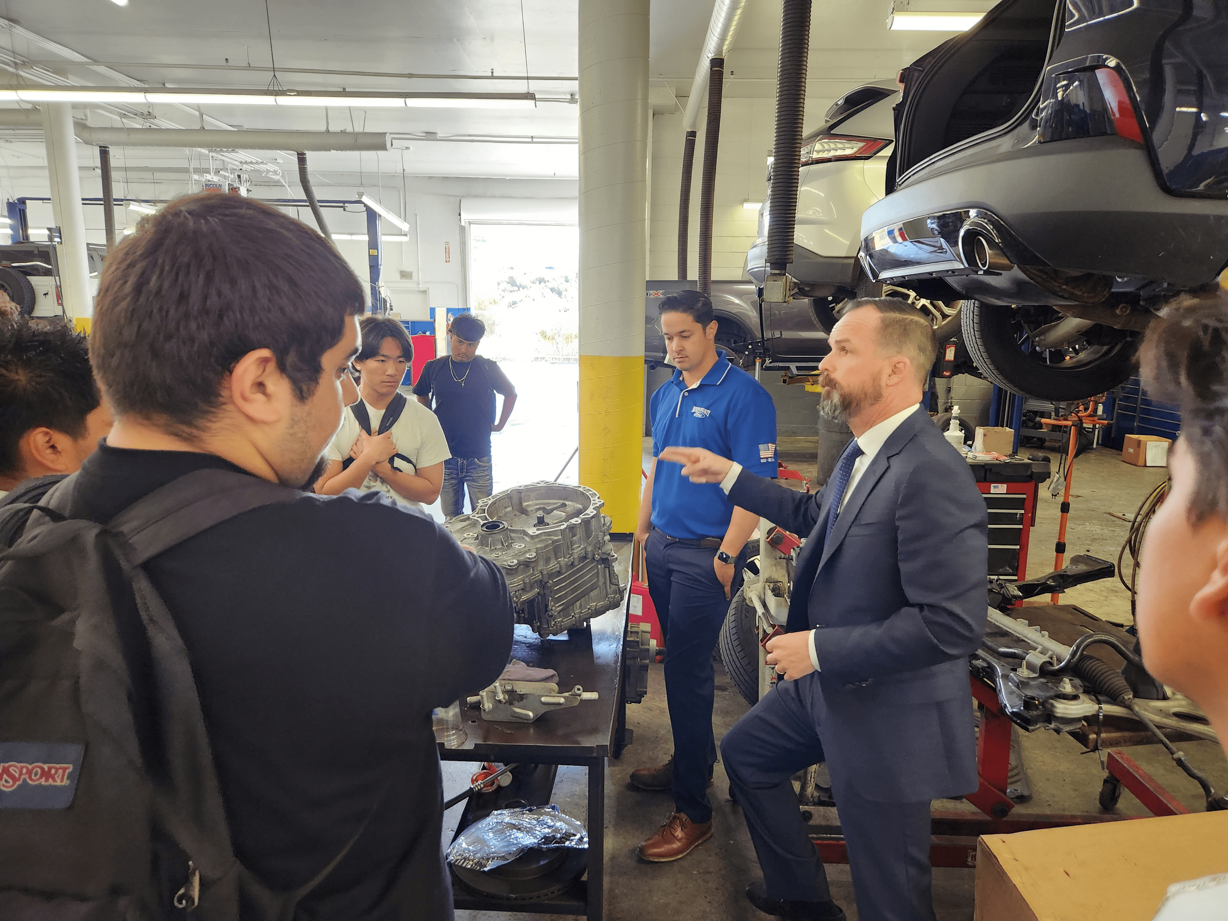 staff members speaking to students