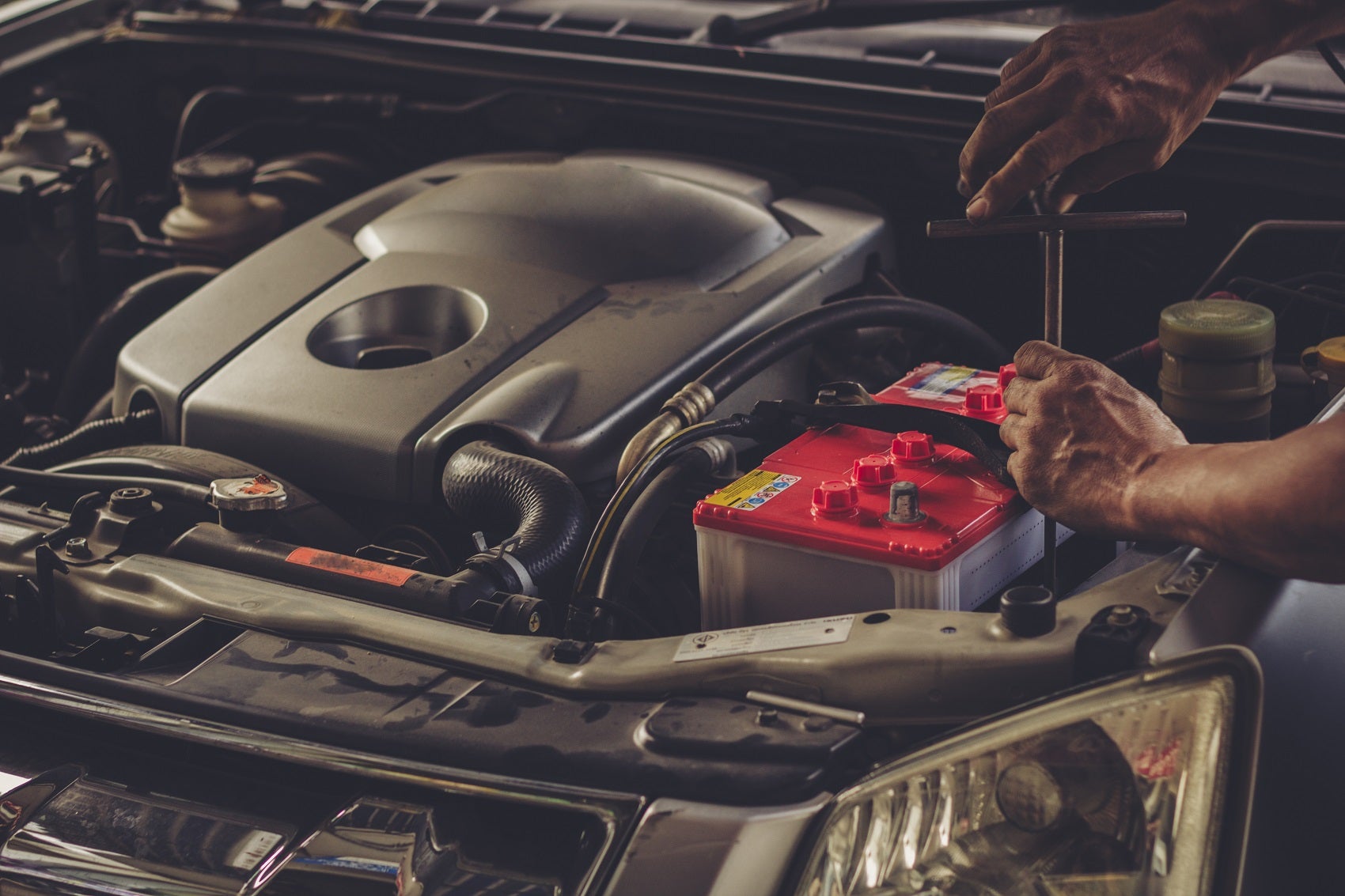Service Technician Working on a Ford Engine