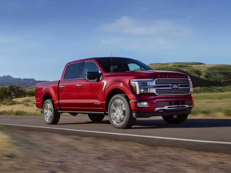Ford F-150 driving down scenic road from Ford F-150 Lease Deals in Vista CA